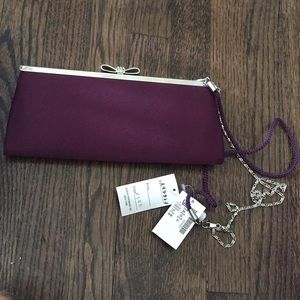 Purple bow clutch with optional strap